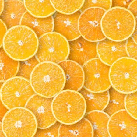 Organic orange fruit slices natural juicy background. Beautiful orange slices bright and vivid.